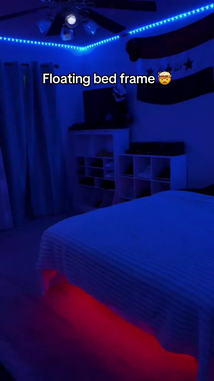 Bed with blue under-glow LED lighting in a bedroom